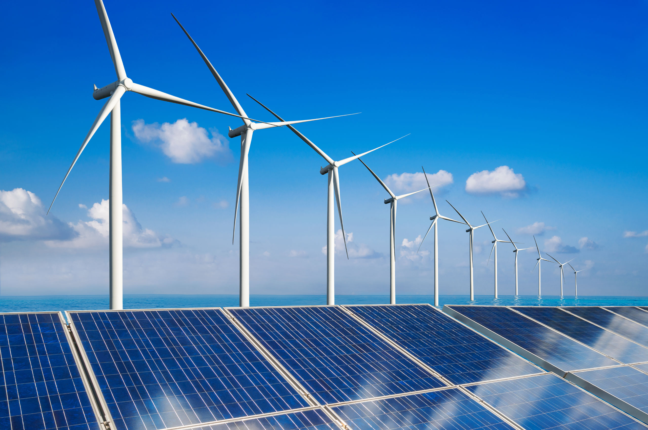 Solar energy panel photovoltaic cell and wind turbine farm power generator in nature landscape for production of renewable green energy is friendly industry. Clean sustainable development concept.